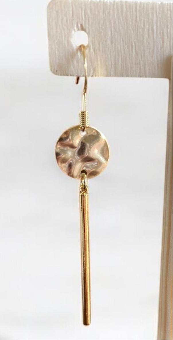 Gold hammered disc with dangle bar.